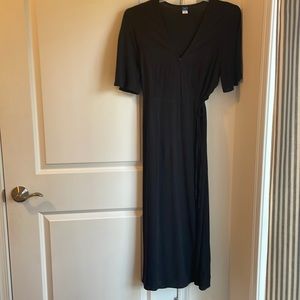 Beautiful black dress wraps around and Ties on waist side.  Never worn